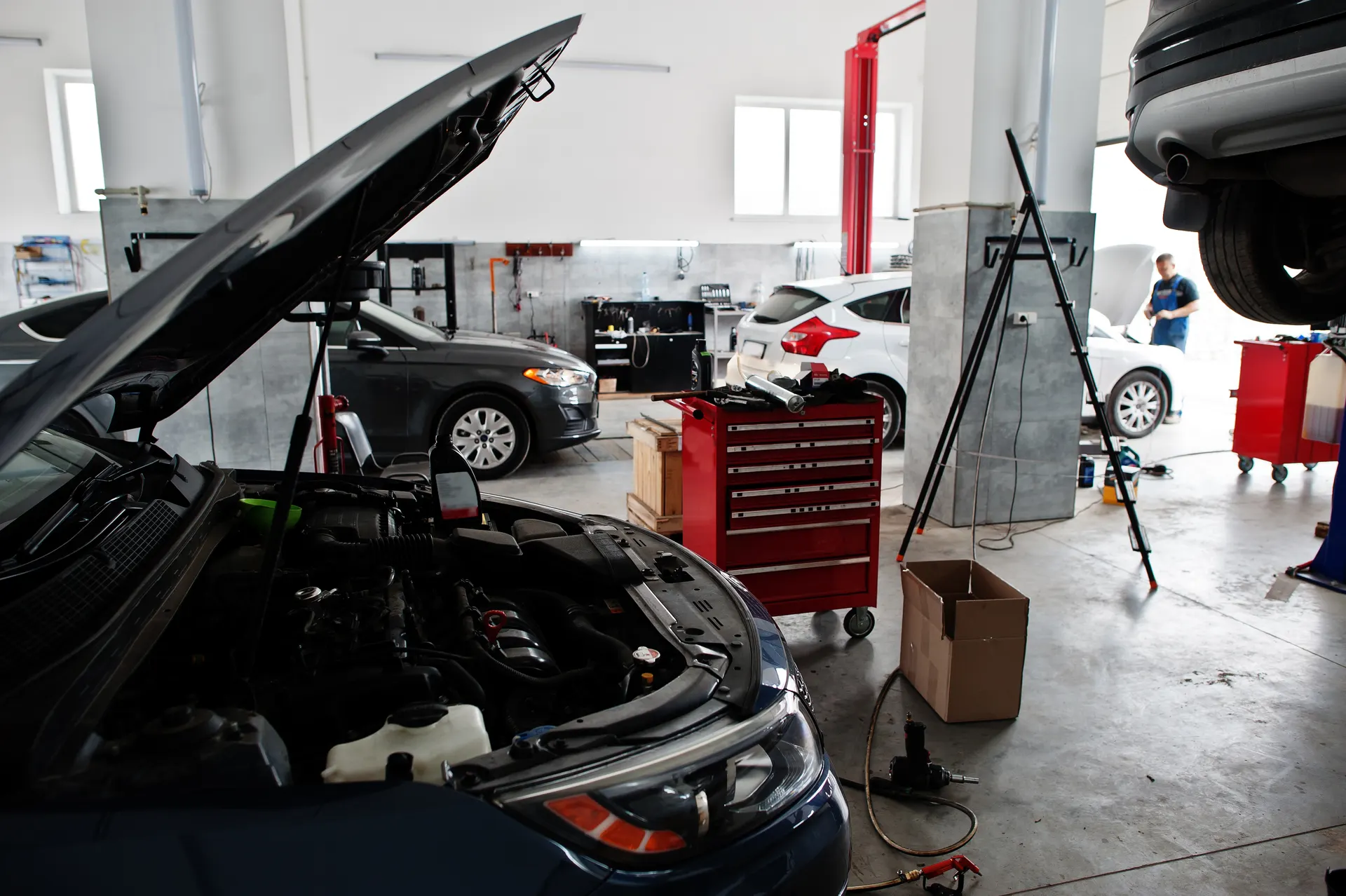 Auto repair bay with vehicles being serviced